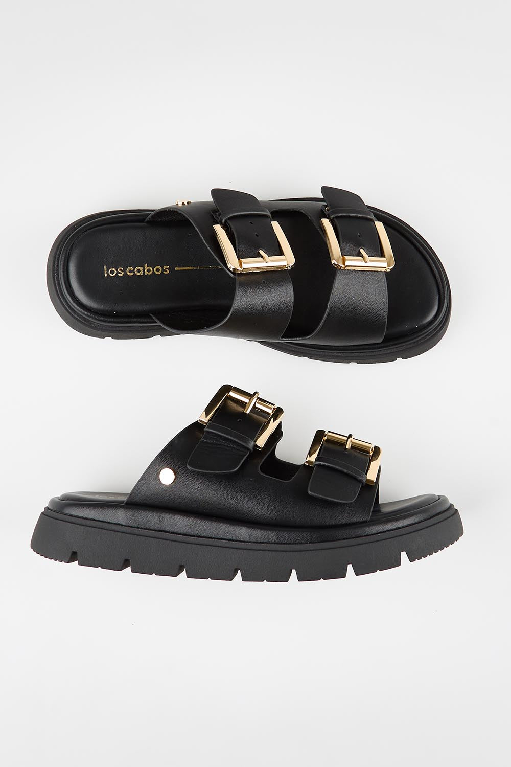 Model Genericm wearing size sample of the Toledo Sandal - Black in colour Black, in a cropped view