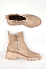A model wearing size 37 of the Vianne Double Zip Boot in colour Taupe, from the front, showing the whole outfit