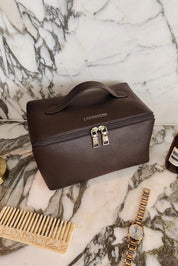 Product shot of the Orion Cosmetic Case - Chocolate in colour Chocolate, from the front