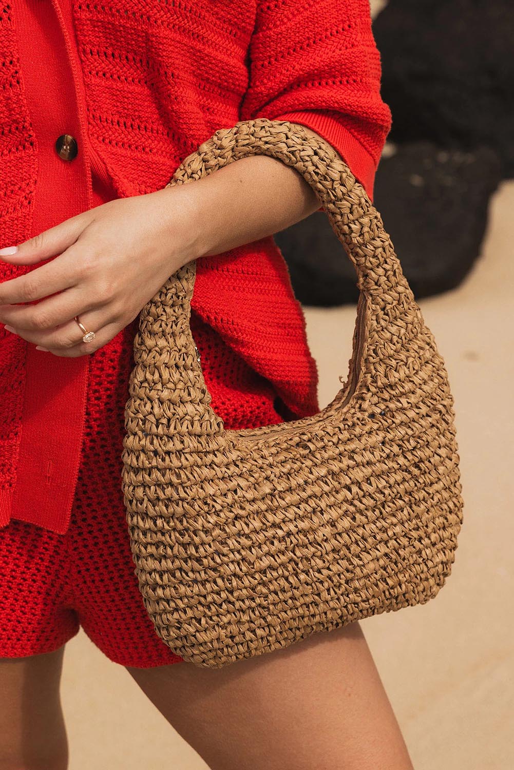 A model wearing the Nellie Woven Handbag in colour Natural, from the front, showing the whole outfit