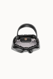 Product shot of the Uma Day Night Crossbody Bag in colour Black (Black), detail