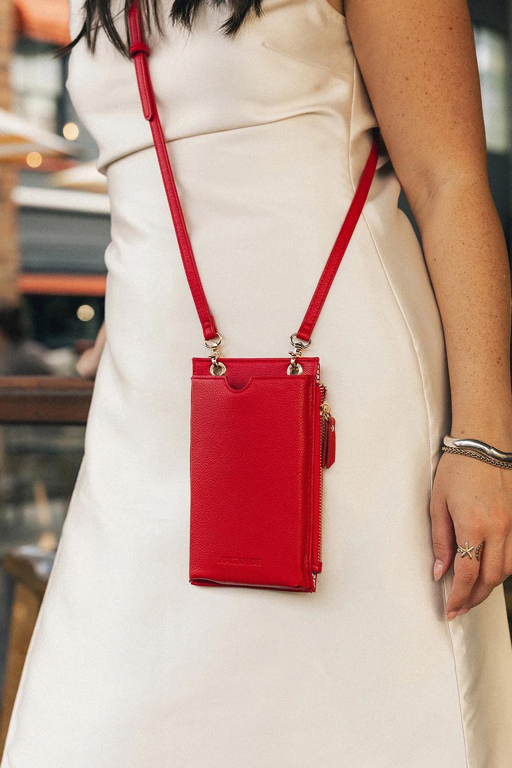 Product shot of the Suki Phone Bag - Red in colour Red, from the back