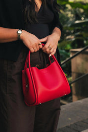 Product shot of the Steffie Mini Tote Bag - Red in colour Red, from the back