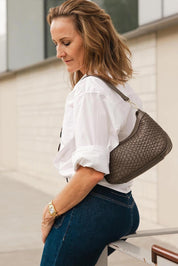 A model wearing the Lucia Woven Shoulder Bag in colour Chocolatew, from the front, showing the whole outfit