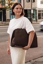 A model wearing the Blaire Tote Bag in colour ChocSuede, from the front, showing the whole outfit
