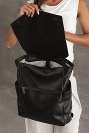 A model wearing the Drew Backpack in colour Black (Black), from the front, showing the whole outfit