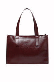 Product shot of the Riley Tote Bag in colour Burgundy (Red), from the front