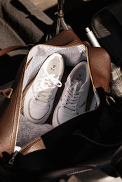 A model wearing the Ohio Overnight Bag in colour Chocolate, from the front, showing the whole outfit