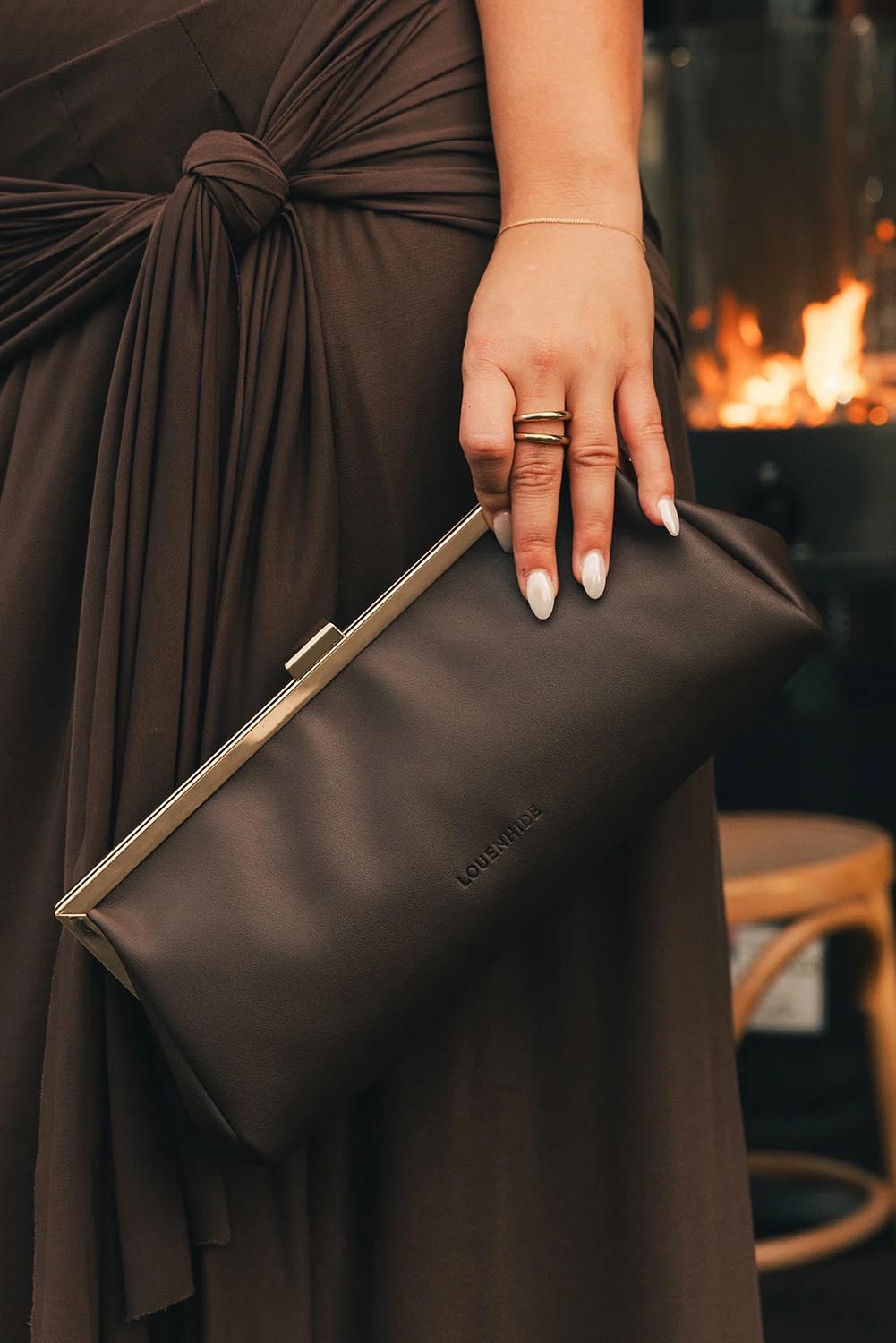 Product shot of the Maya Clutch - Chocolate in colour Chocolate, from the back