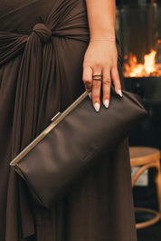 Product shot of the Maya Clutch - Chocolate in colour Chocolate, from the back
