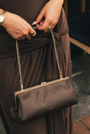 Product shot of the Maya Clutch - Chocolate in colour Chocolate, from the front