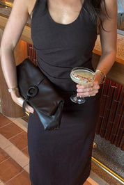 Product shot of the Asha Clutch - Chocolate in colour Chocolate, from the back