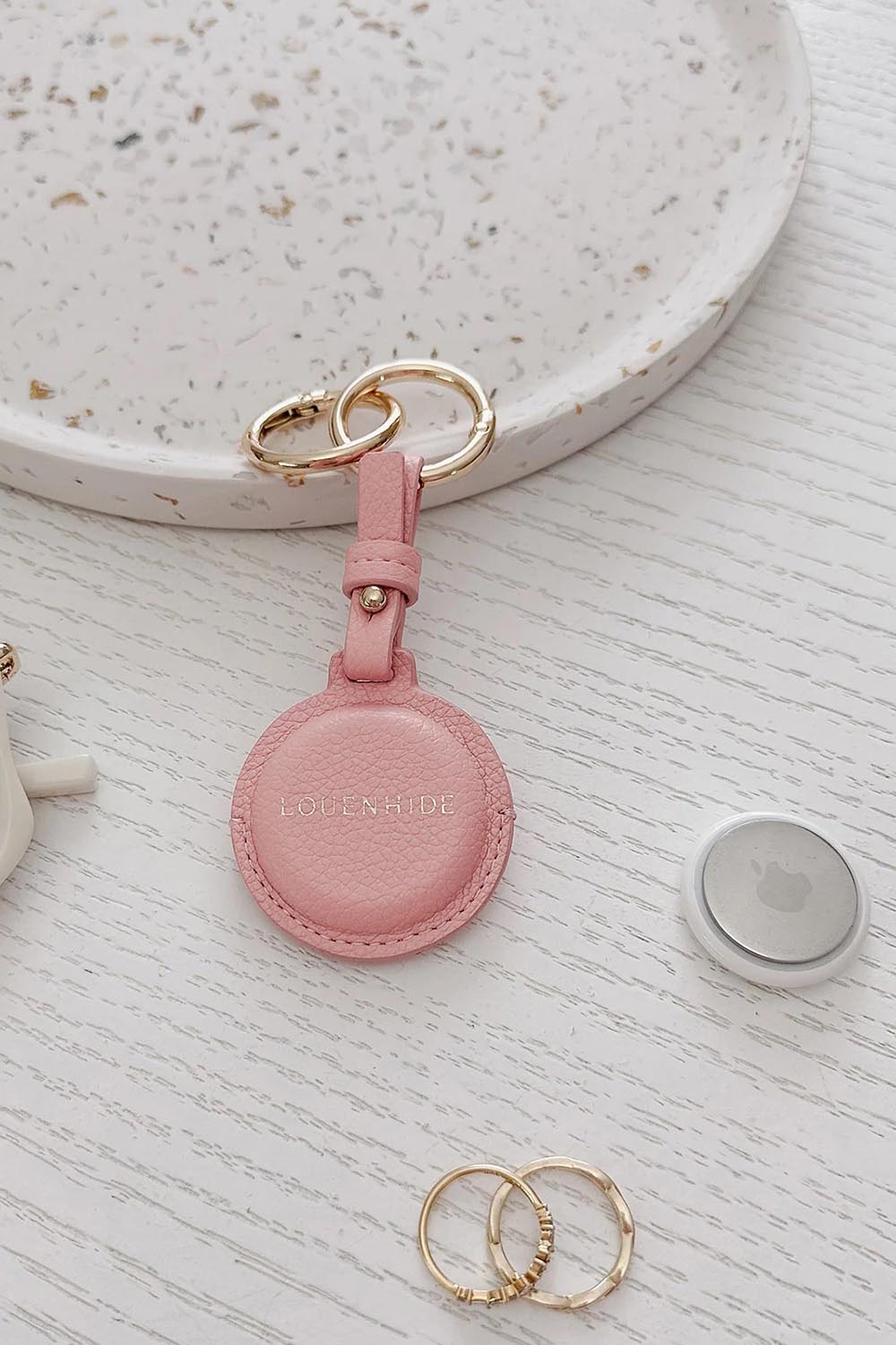 Product shot of the Opal Airtag Holder - Pink in colour Pink, from the back