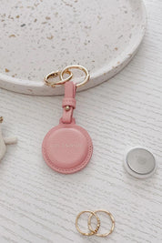 Product shot of the Opal Airtag Holder - Pink in colour Pink, from the back