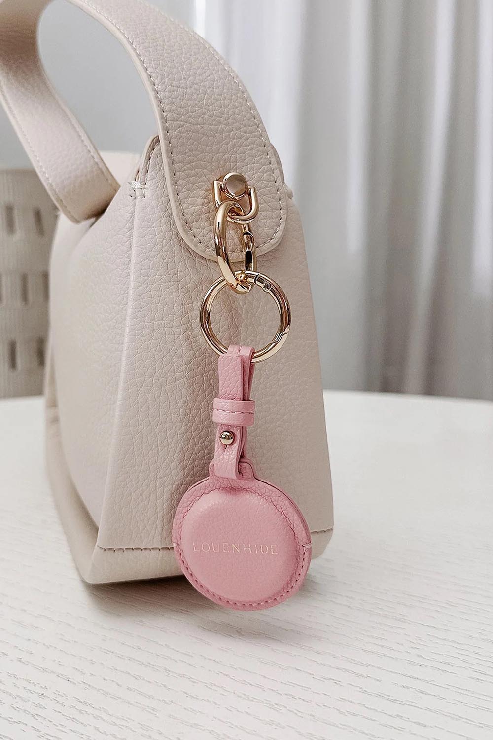 Product shot of the Opal Airtag Holder - Pink in colour Pink, showing detail