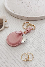 Product shot of the Opal Airtag Holder - Pink in colour Pink, from the front