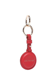 Product shot of the Opal Airtag Holder - Red in colour Red, showing detail