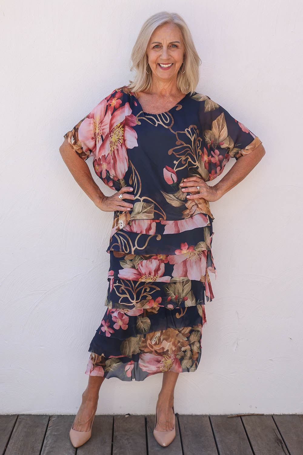 Model Sandy wearing the Silk Blend Multi Layers Dress in colour Navyfloral (Blue), from the front, showing the whole outfit