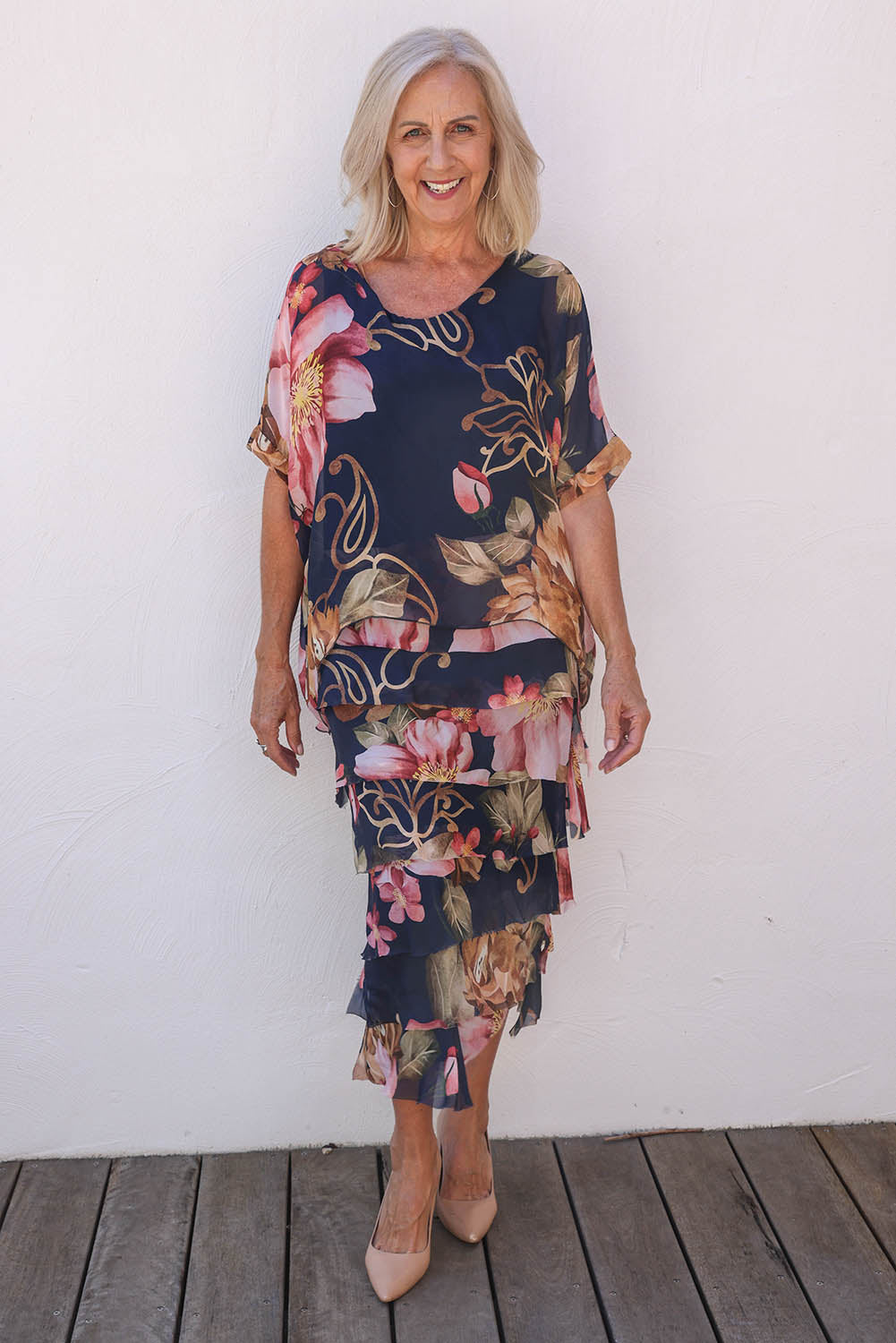 Model Sandy wearing the Silk Blend Multi Layers Dress in colour Navyfloral (Blue), from the front, showing the whole outfit