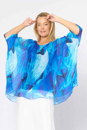 Model Genericm wearing size sample of the Silk Blend Printed Kaftan Top - Cobaltprint in colour Cobaltprint, in a cropped view