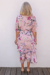 Model Sandy wearing the Short Sleeve Silk Blend Print Dress in colour Blushpink (Pink), from the back