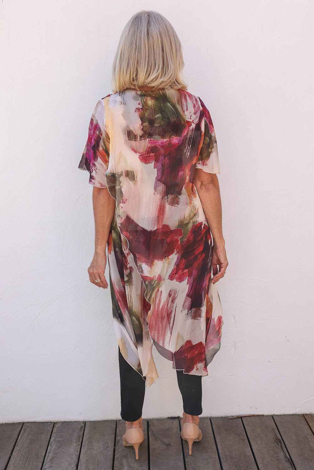 Model Sandy wearing the Silk Blend Overlay Top in colour Beigeprint, from the back