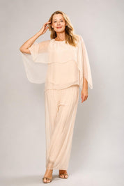 Model Genericm wearing size sample of the Silk Blend Cape Top - Beige in colour Beige, from the front