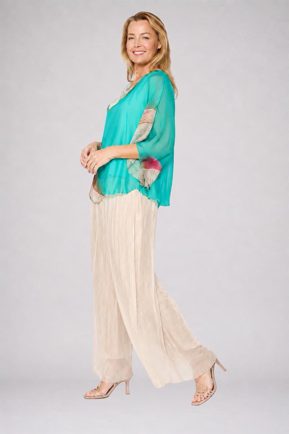 Model Genericm wearing size sample of the Silk Blend Flounce Sleeve Top - Blueturqprint in colour Blueturqprint, from the front