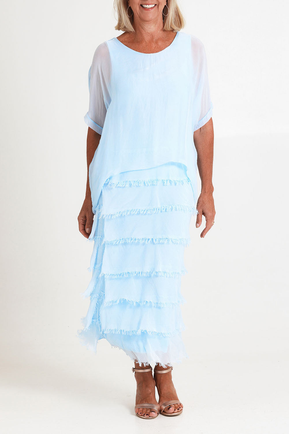 Model Sandy wearing the Silk Blend Multi Layers Dress in colour Celeste (Blue), from the front, cropped image