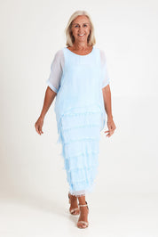 Model Sandy wearing the Silk Blend Multi Layers Dress in colour Celeste (Blue), from the front, showing the whole outfit