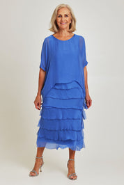 Model Sandy wearing the Silk Blend Multi Layers Dress in colour Cobalt (Blue), from the front, showing the whole outfit