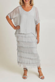 Model Sandy wearing the Silk Blend Multi Layers Dress in colour Grigio (Grey), from the front, cropped image