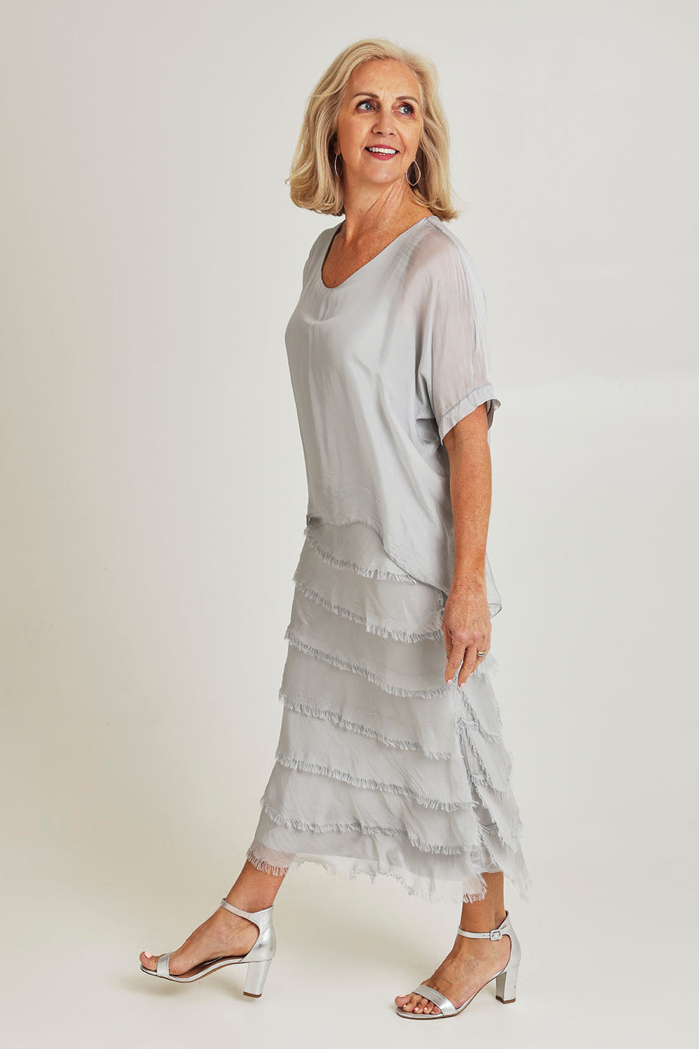 Model Sandy wearing the Silk Blend Multi Layers Dress in colour Grigio (Grey), from the front, showing the whole outfit