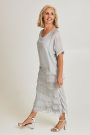 Model Sandy wearing the Silk Blend Multi Layers Dress in colour Grigio (Grey), from the front, showing the whole outfit