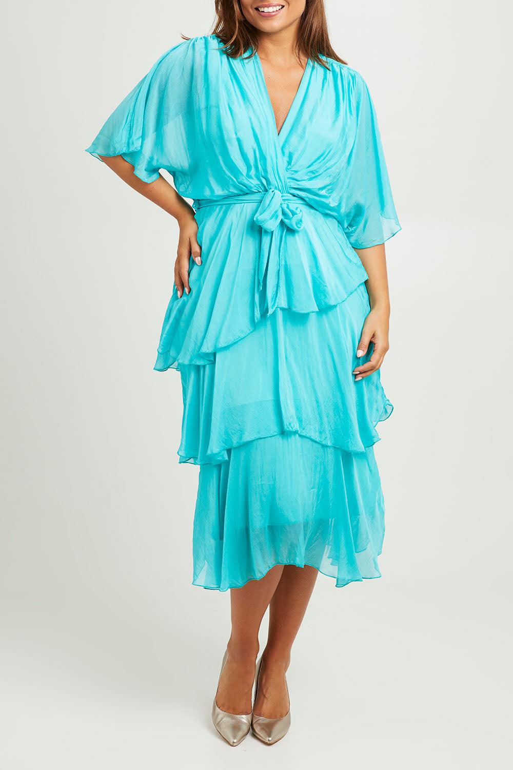 Model Monique wearing the Short Sleeve Silk Dress in colour Aqua (Green), from the front, cropped image