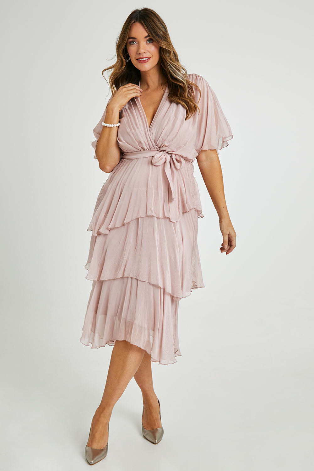 Model Laura wearing the Short Sleeve Silk Dress in colour Blushpink (Pink), from the front, showing the whole outfit