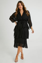 Model Laura wearing the Long Sleeve Silk Dress in colour Black (Black), from the front, showing the whole outfit
