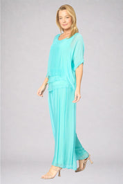Model Genericm wearing size sample of the Silk Pant - Acqua in colour Acqua, from the front