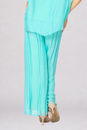 Model Genericm wearing size sample of the Silk Pant - Acqua in colour Acqua, from the front