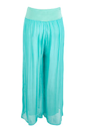 Product shot of the Silk Pant - Acqua in colour Acqua, from the back
