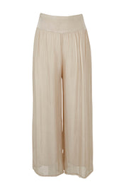 Product shot of the Silk Pant in colour Beige, from the front