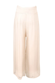 Product shot of the Silk Pant in colour Ivory, from the back