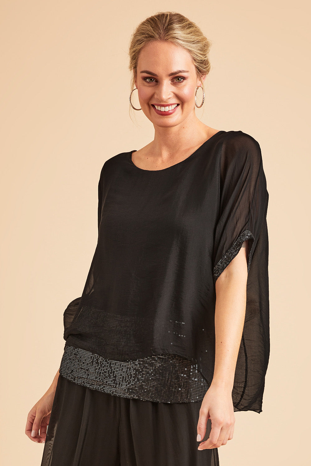 Model Grace wearing the Silk Sequin Top in colour Black (Black), from the front, showing the whole outfit