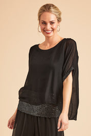 Model Grace wearing the Silk Sequin Top in colour Black (Black), from the front, showing the whole outfit
