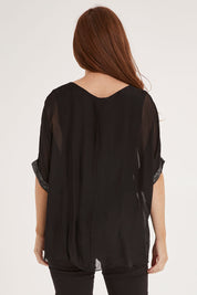 Model Sally wearing the Silk Sequin Top in colour Black (Black), from the back