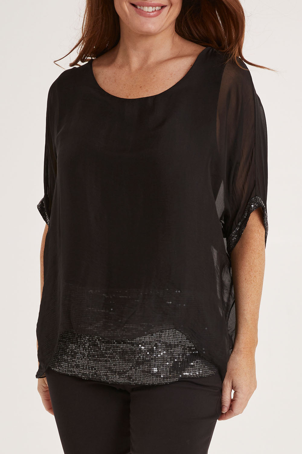 Model Sally wearing the Silk Sequin Top in colour Black (Black), from the front, cropped image