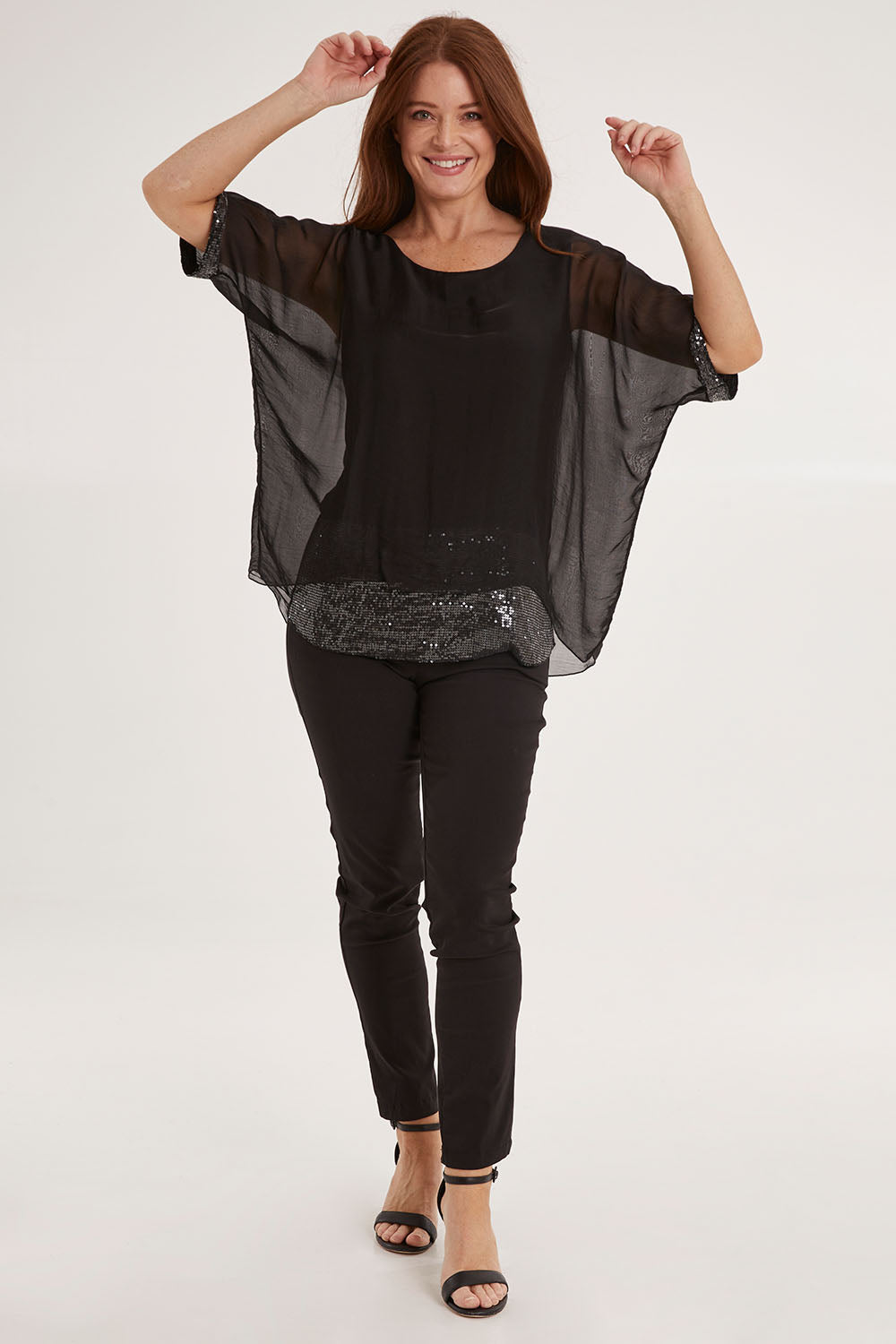Model Sally wearing the Silk Sequin Top in colour Black (Black), from the front, showing the whole outfit