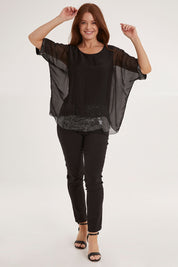 Model Sally wearing the Silk Sequin Top in colour Black (Black), from the front, showing the whole outfit