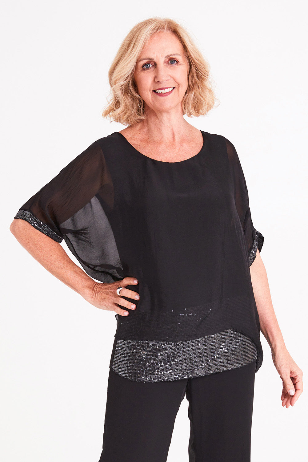 Model Sandy wearing the Silk Sequin Top in colour Black (Black), from the front, cropped image