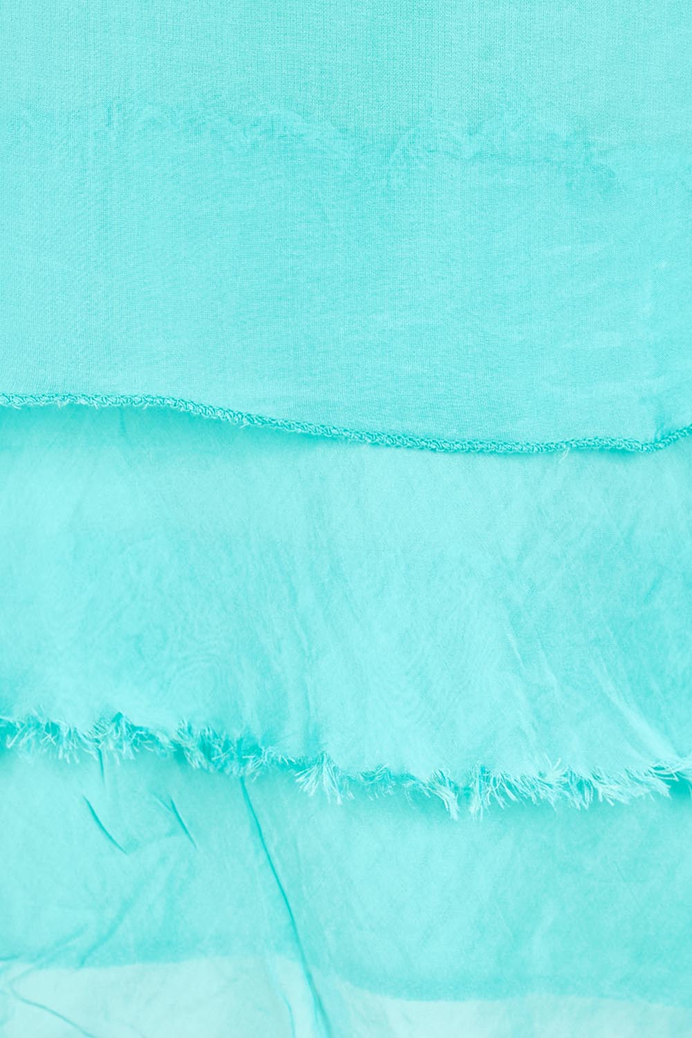 Product shot of the Silk Blend Three Layer Raw Edge Top - Acqua in colour Acqua, showing detail
